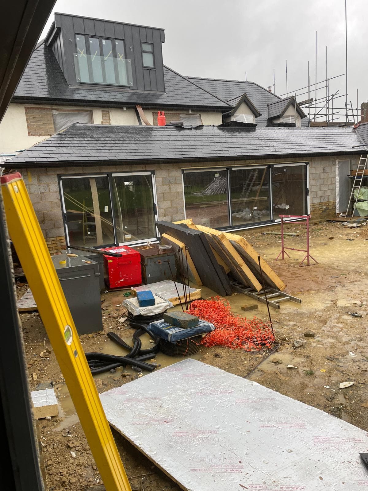 Rear of a property with new glazing installed and works ongoing.