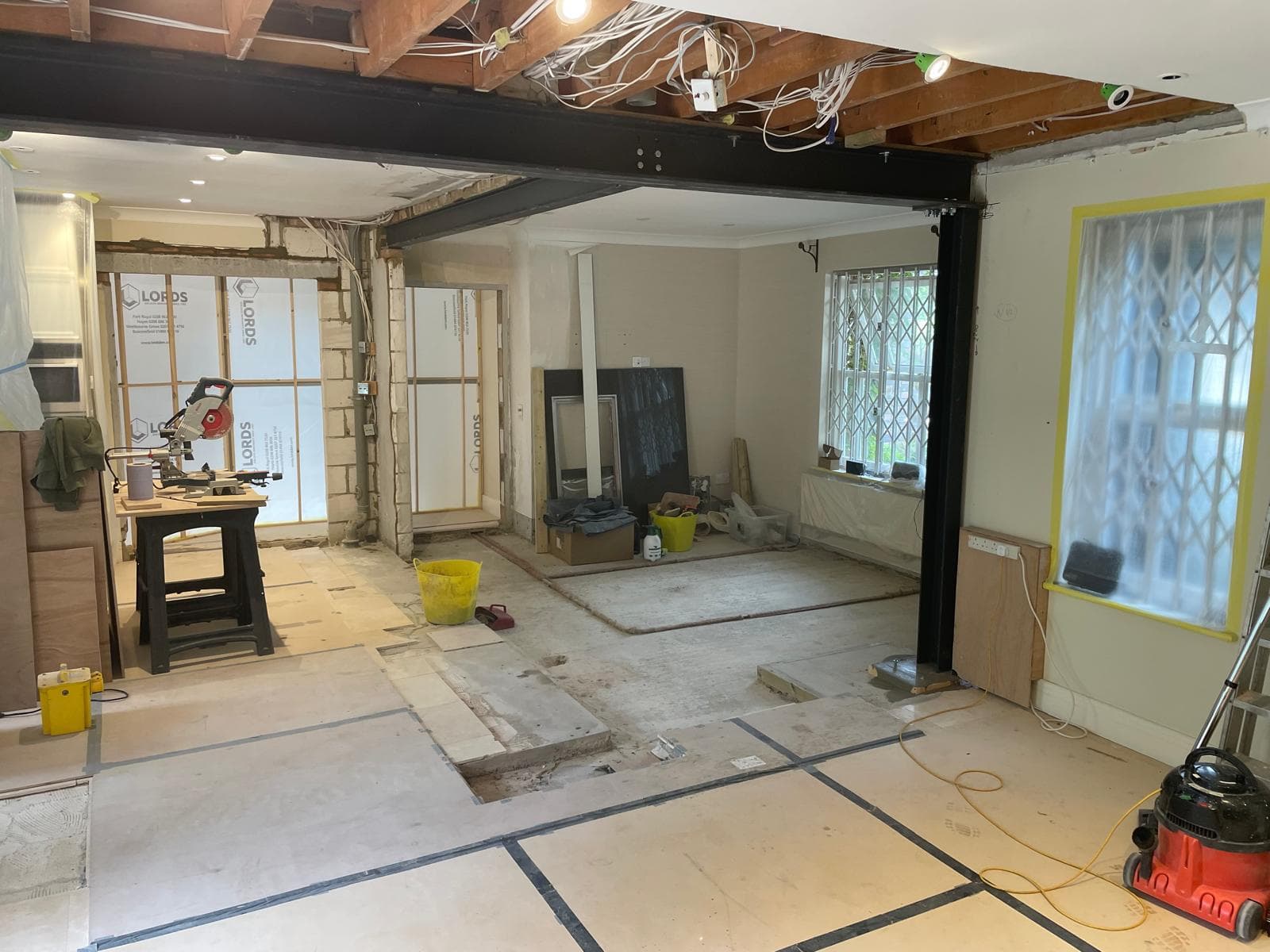 Ground floor opened up with new steel beams spanning the space.